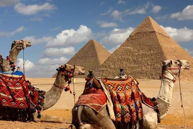 Giza pyramids sunset camel ride with local dinner