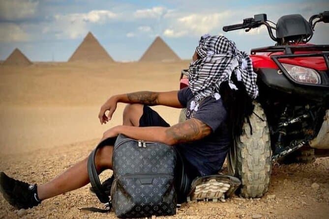 ATV ride at the desert of GIZA pyramids at sunrise or sunset