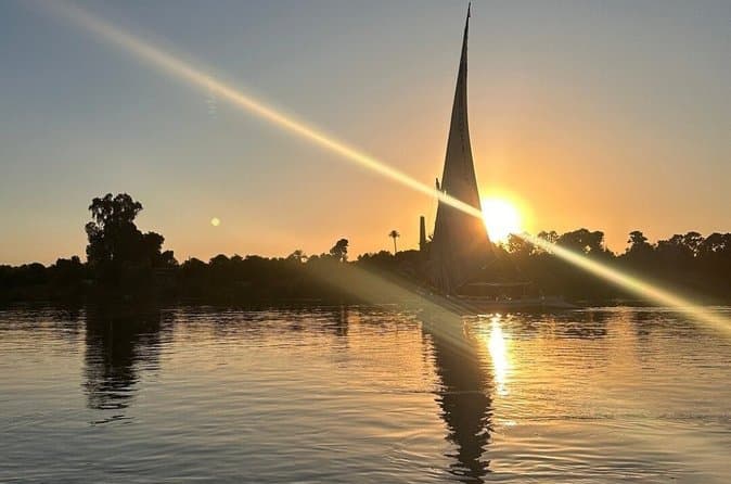 Luxor sunset sailboat smile