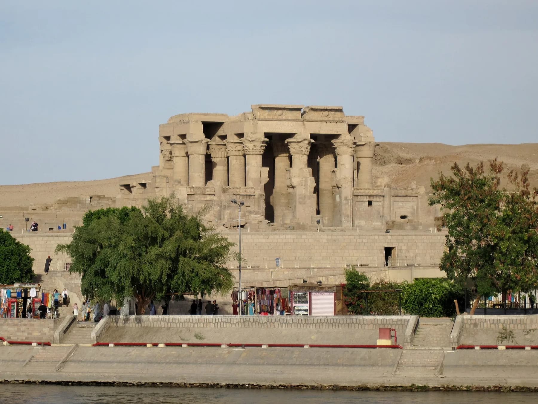 Kom Ombo temple seen from the Nile, riverside promenade in front