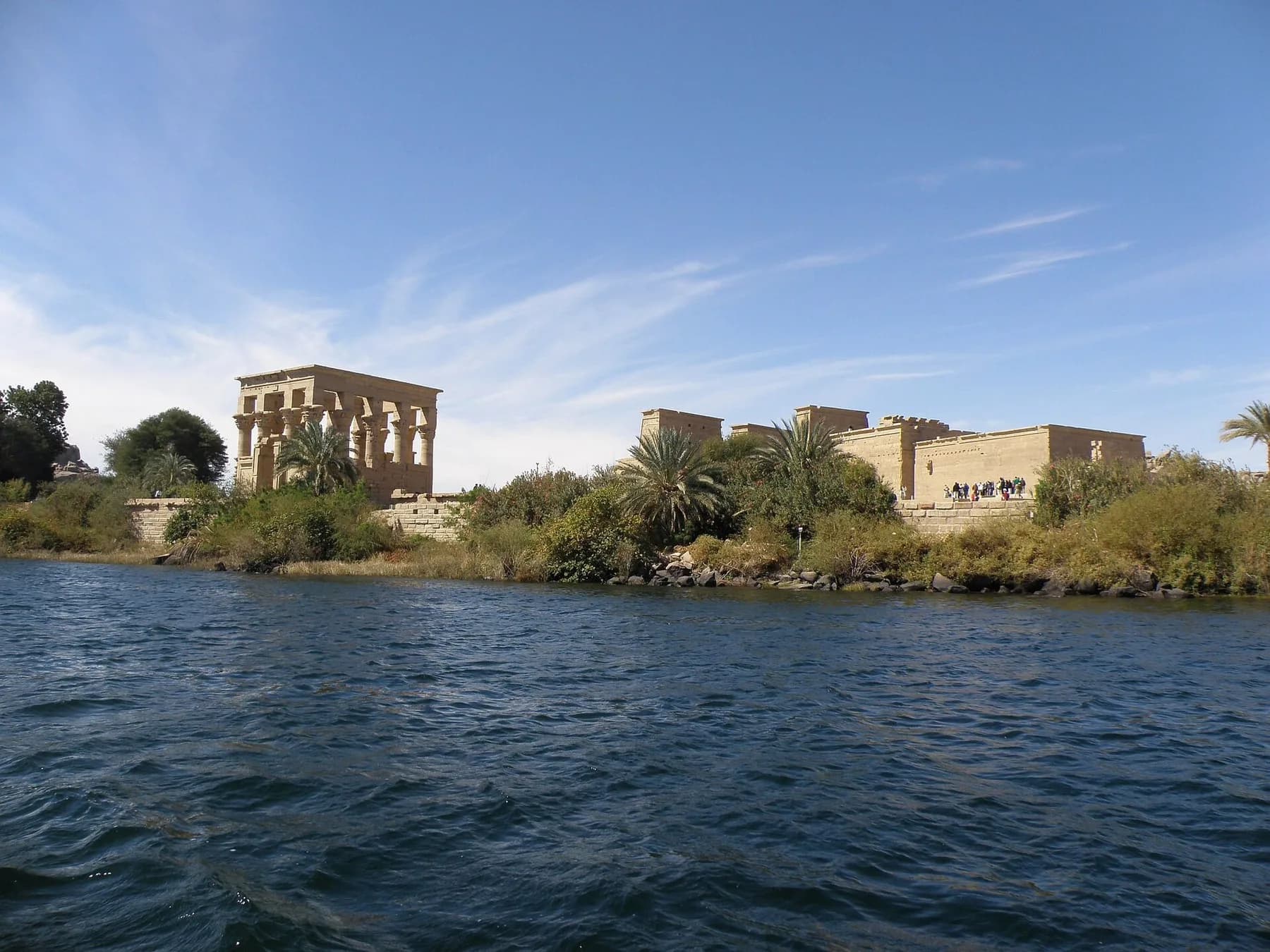 Philae island temples seen from a boat on approach