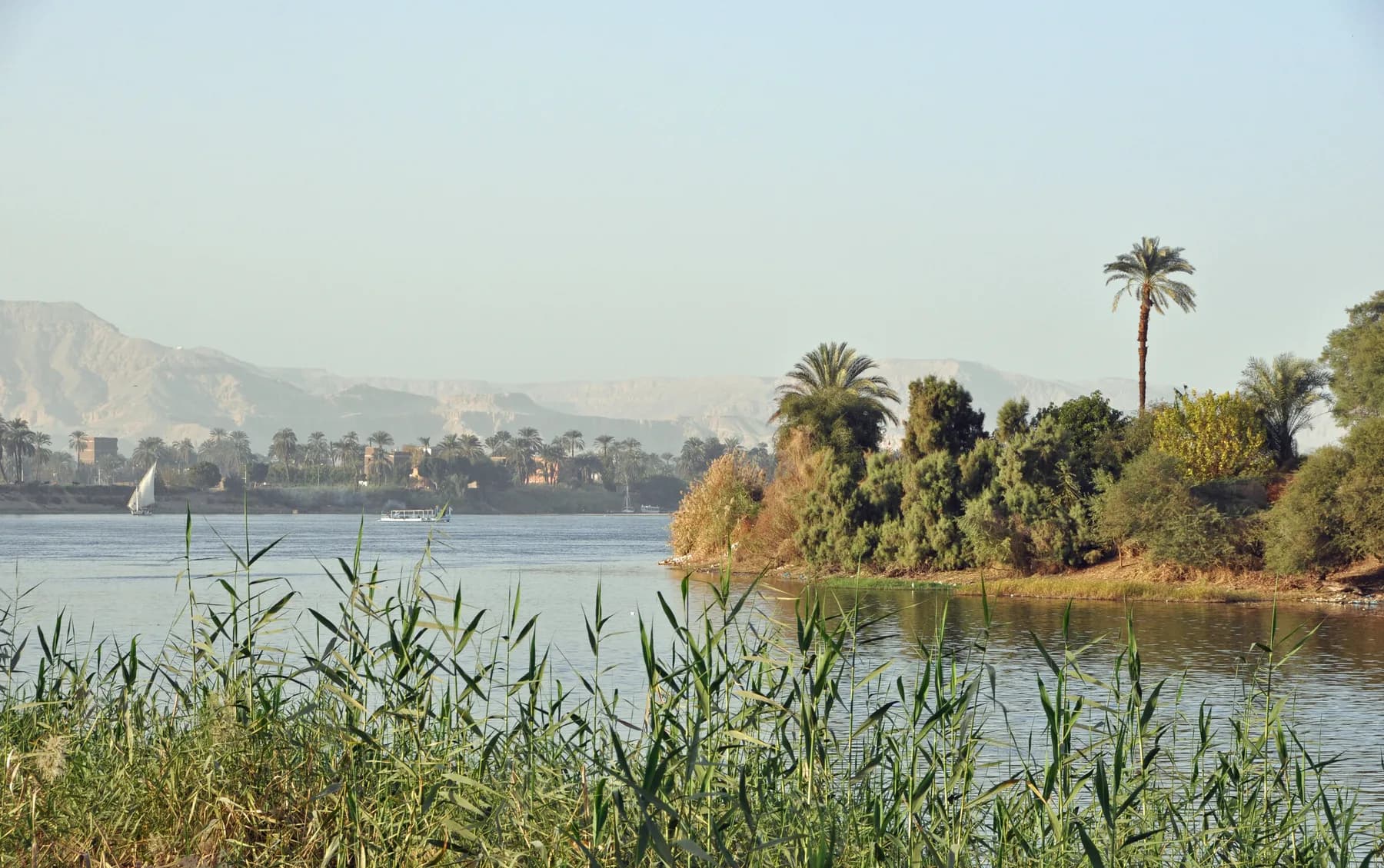 Clear January light on the Nile at King's Island, Luxor, Theban hills behind