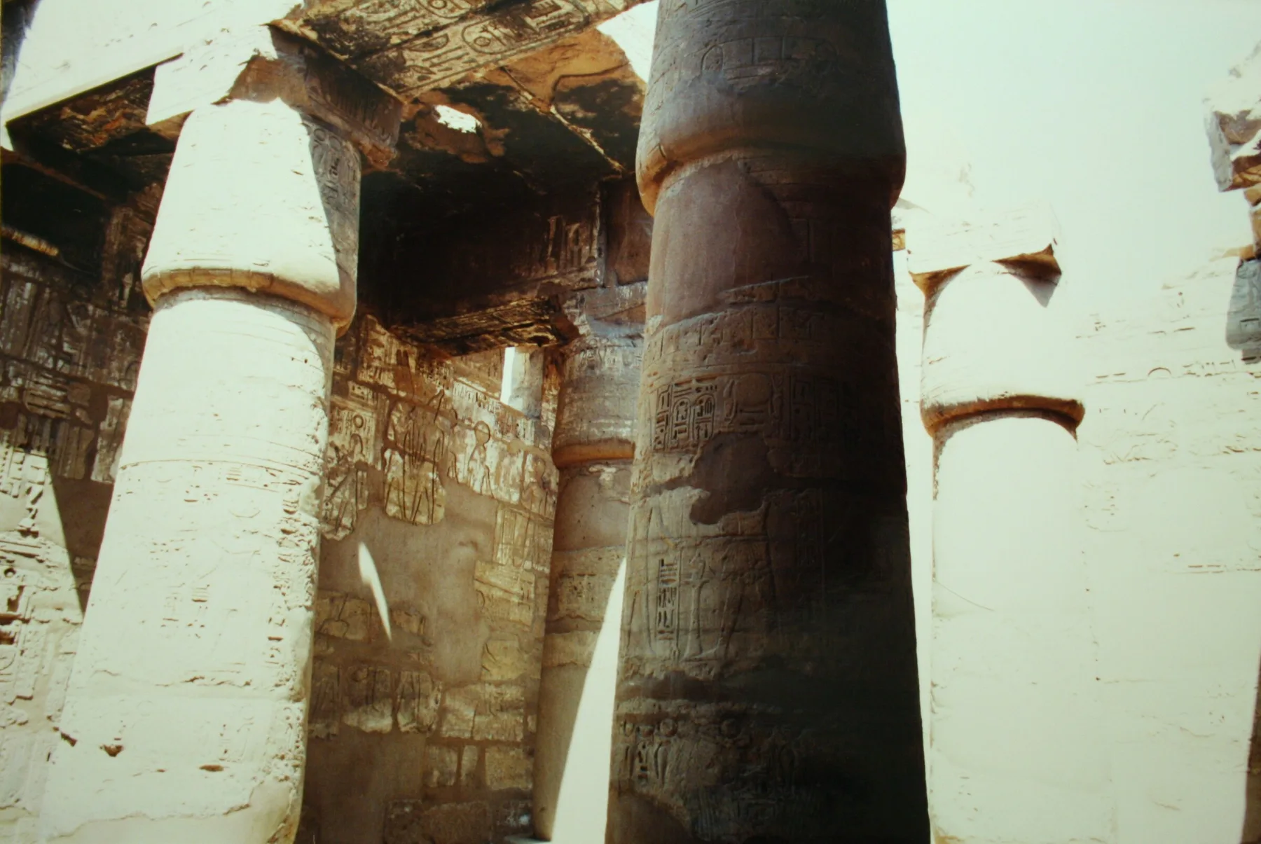 Karnak Great Hypostyle Hall columns in harsh, bleached June light
