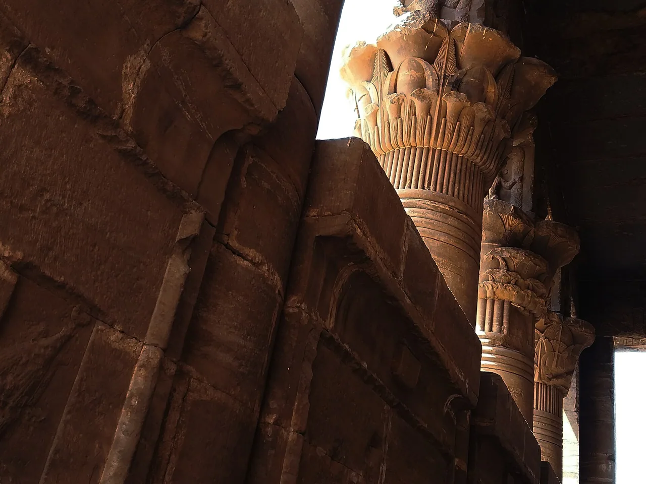 A carved Hathor-headed capital on a column at Dendera