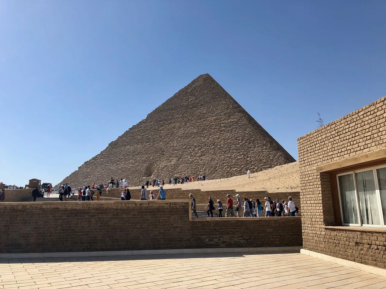 Visitors gathered below the Great Pyramid of Khufu at Giza