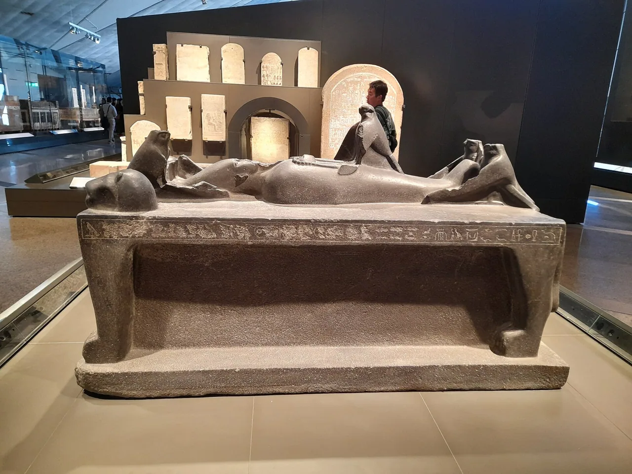 A stone sarcophagus on display in the Grand Egyptian Museum