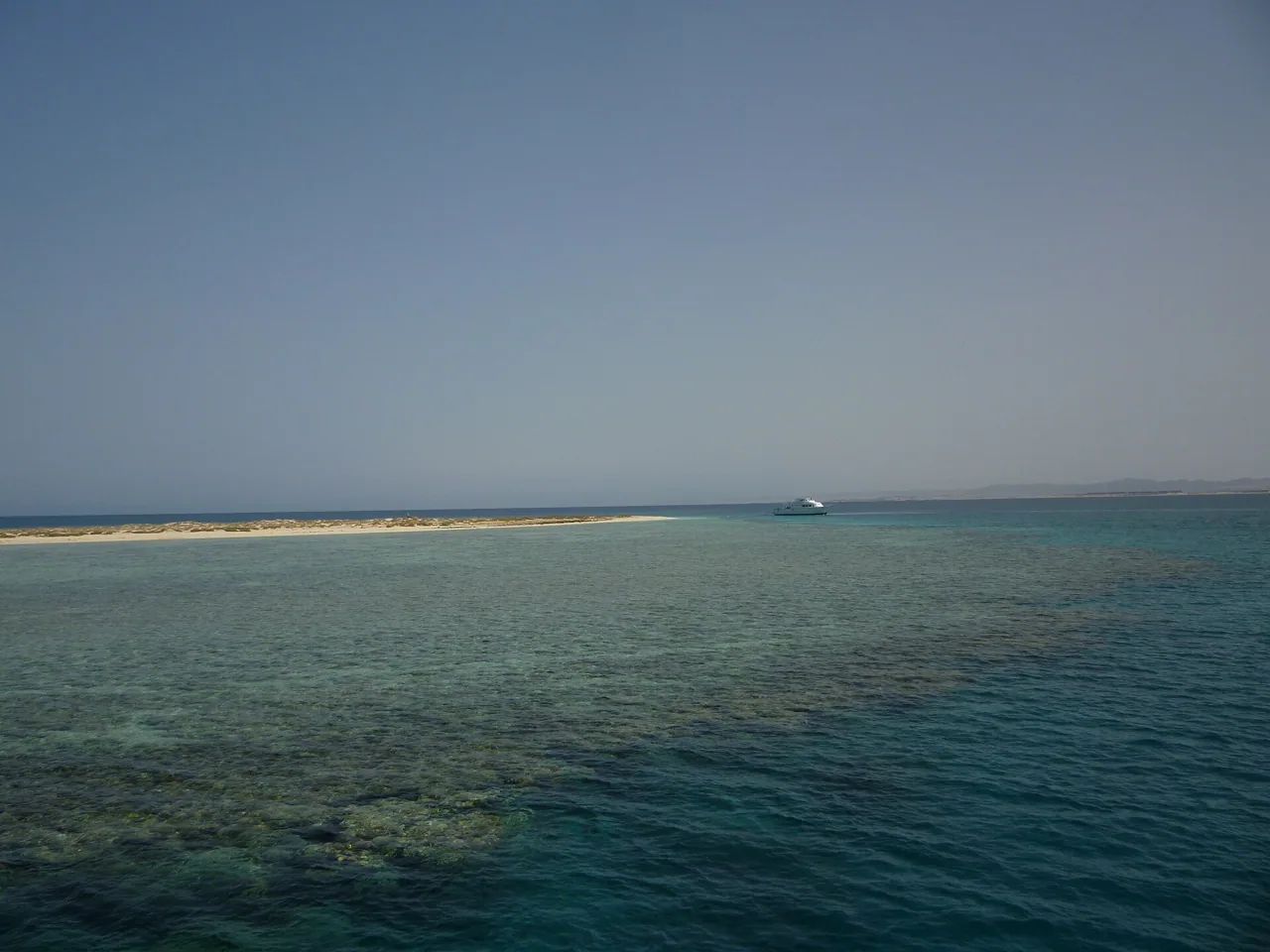 Shallow reef and a sand bar in clear water off the southern Red Sea coast near Marsa Alam